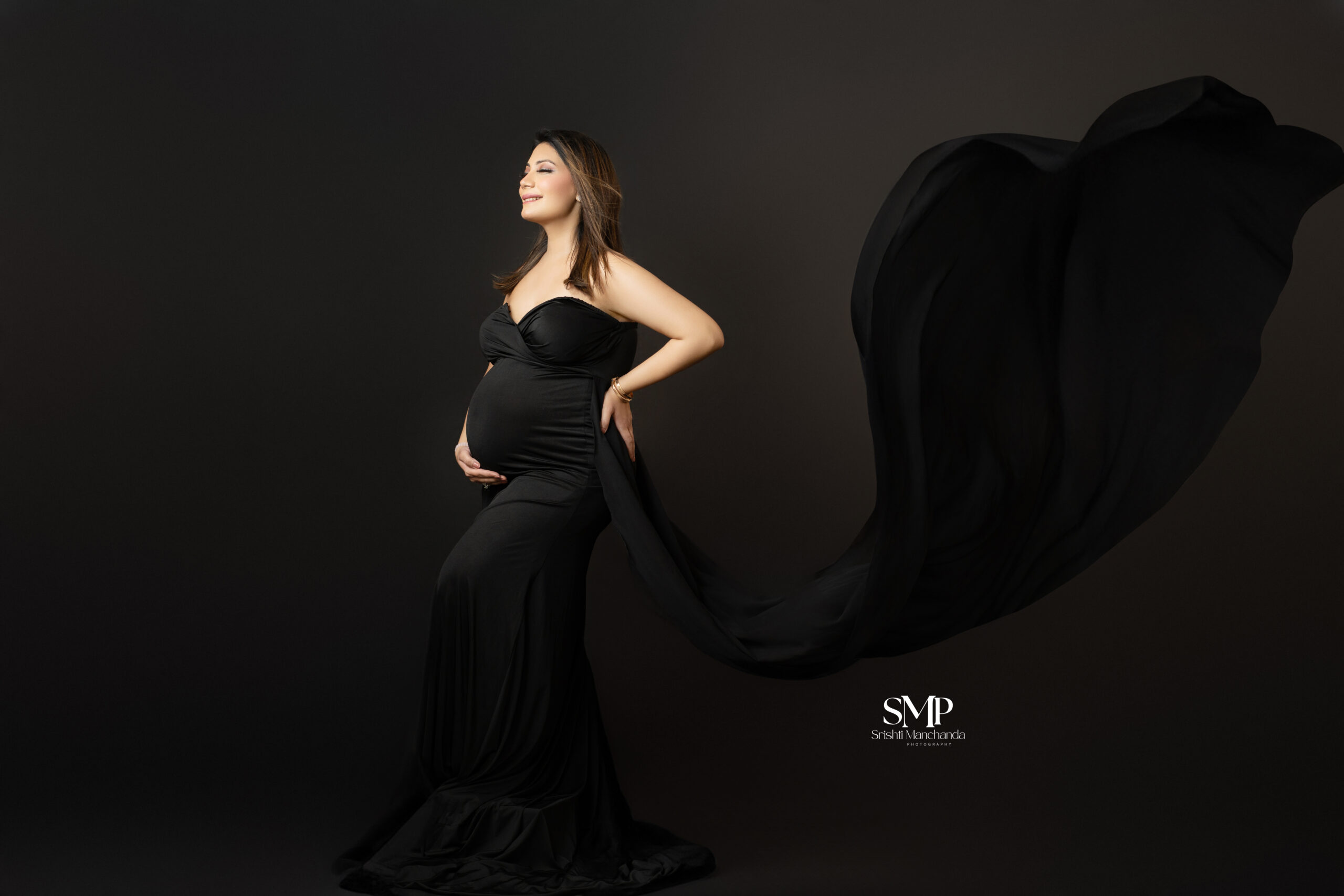 glowing pregnant woman studio portrait professional